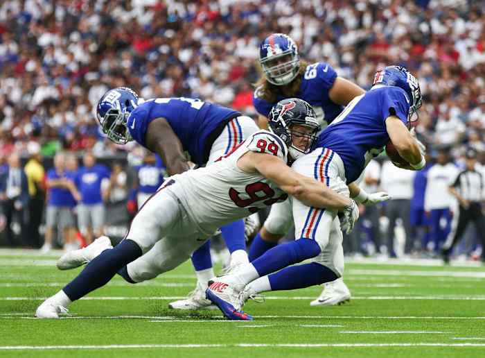 Houston Texans defensive end J.J. Watt dives to sack Eli Manning